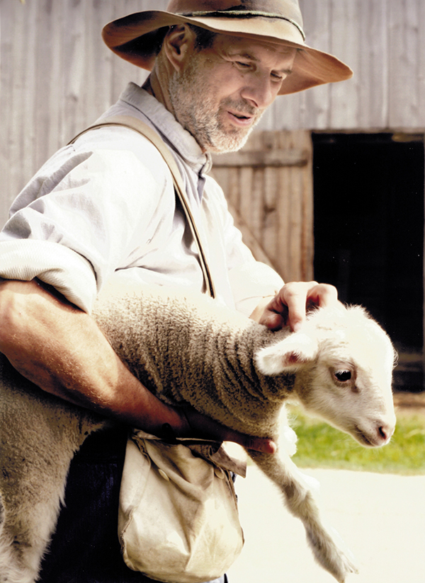Farmer with lamb at Old World Wisconsin.